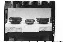 Three pottery vessels from tomb in ball court