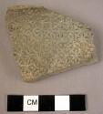 Potsherd with floral geometric stamped decoration