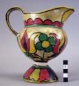 Ceramic pitcher with polychrome designs