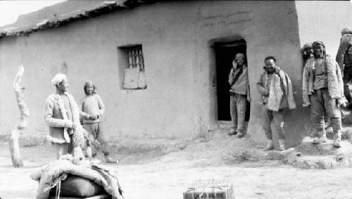 People standing by building