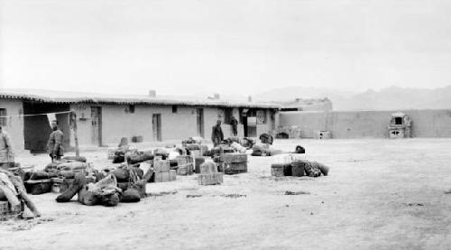 People and boxes outside of building