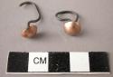 Pair of ear rings worn by a boy