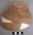 Part of rubbed indented corrugated pottery olla