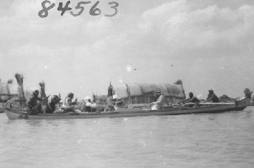 Close view of a boat with village in the background