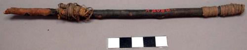 Small stick with wrappings of sinew