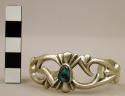 Cuff bracelet, small cast silver band w/ open decorative design w/ turq. stone