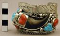 Cuff bracelet, silver band richly adorned w/ stones, silver dec., and bear claw