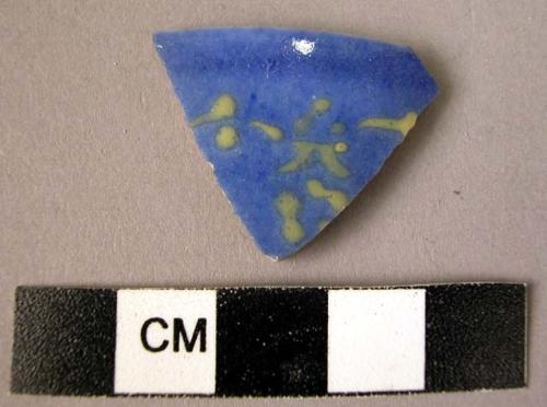 Rim potsherd - green on blue glaze; slip under glaze