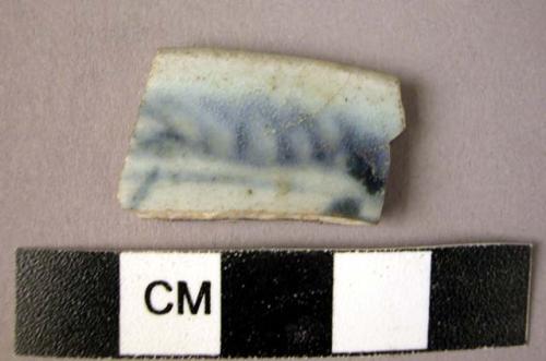 Rim potsherd - blue on white glaze