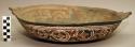 Earthenware dish with cord-impressed and polychrome designs on exterior and polychrome designs on interior