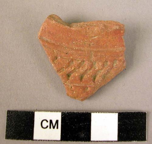 Potsherd - red-brown, incised