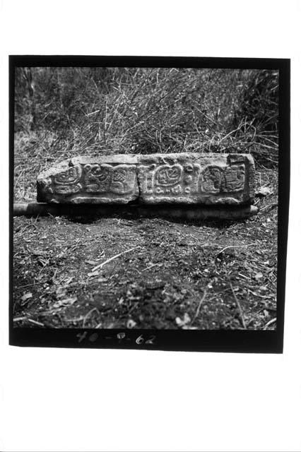 Glyphic lintel in Spanish wall