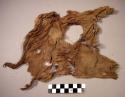 Woven textile fragment, brown, torn