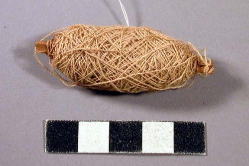 Cotton yarn wound around stick, bobbin?