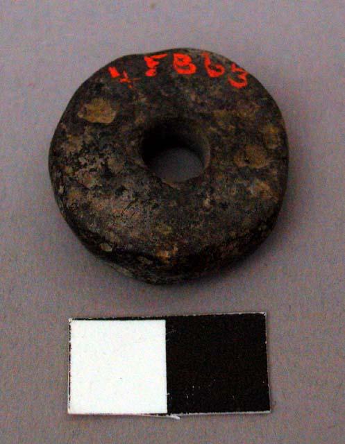 Spindle whorl, stone