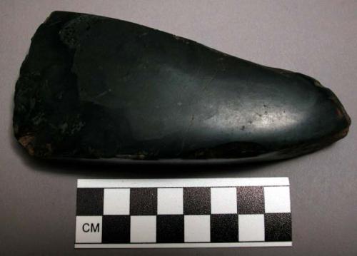 Stone axe heads and celts, ground and polished, e, f, and g appear to be basalt.