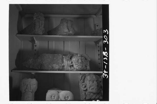 Sculptured stone heads and faces