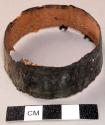 Unclassified tool, bark ring with black pigment exterior, jagged edge