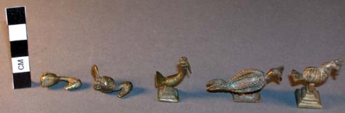 Cast brass or bronze effigies of birds