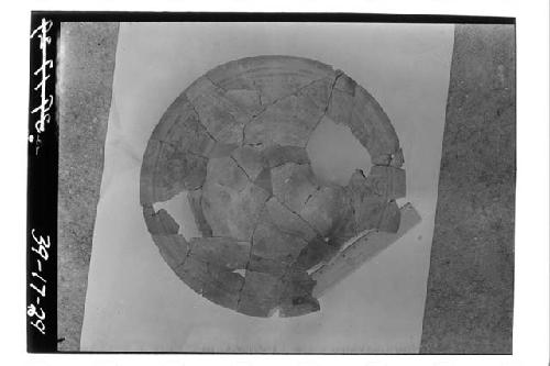 Top view of coarse polychrome plate found in test pit 1-39, cut 7.