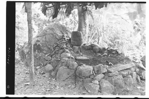 Ancient stone sculpture re-used in modern Mam Indian shrine