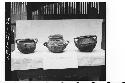 Three pottery vessels from tomb in ball court