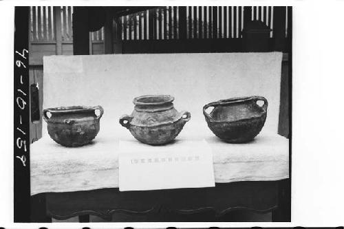 Three pottery vessels from tomb in ball court