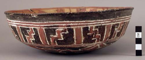 Earthenware bowl with cord-impressed and polychrome designs on exterior and polychrome designs on interior, mended