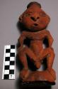 Small carved wooden house god - male figure