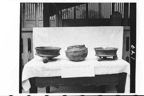 Three pottery vessels from tomb in ball court