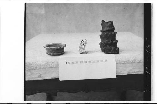 Pottery vessel, stucco mask and pottery fragment from Tomb in Ballcourt