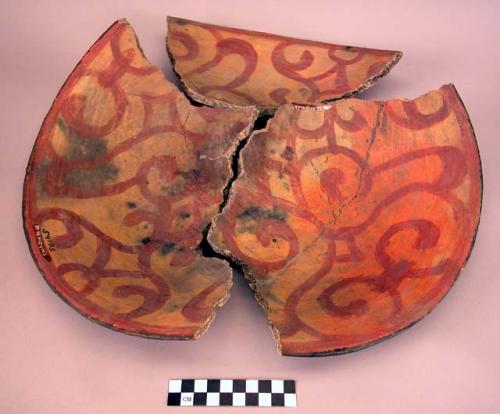 Earthenware bowl with polychrome designs interior, broken