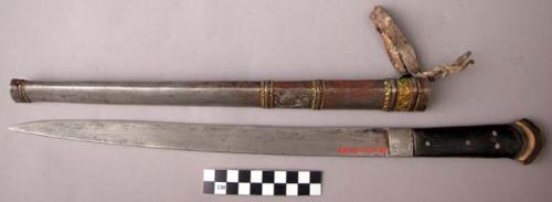 Tibetan knife - bone handles, typical decoration, brass trimmed iron sheath.