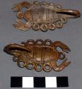Cast brass or bronze ear(?) ornaments representing scorpion