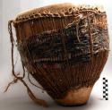 Drum, tapered wood body with hide head and binding, strip of reptile skin, strap
