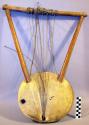 Stringed instrument, wood body and frame, hide head, 8 sinew strings