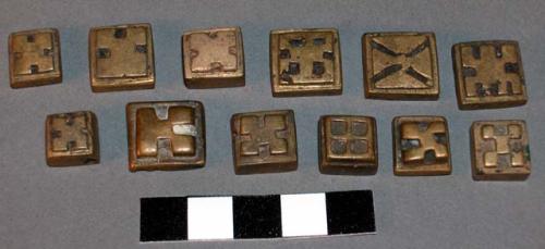 Cast brass or bronze stamps(?) - cross shaped figure