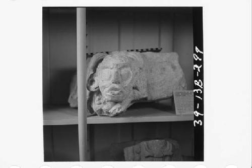 Grotesque sculptured stone head and tenon