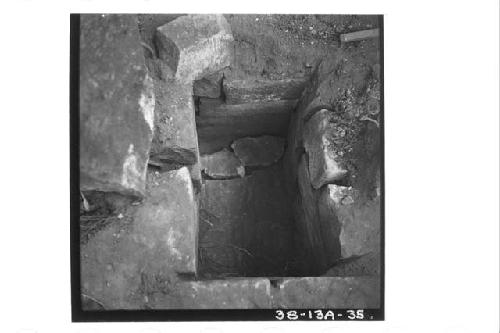 Emptied cist under stairway, north side Temple 11