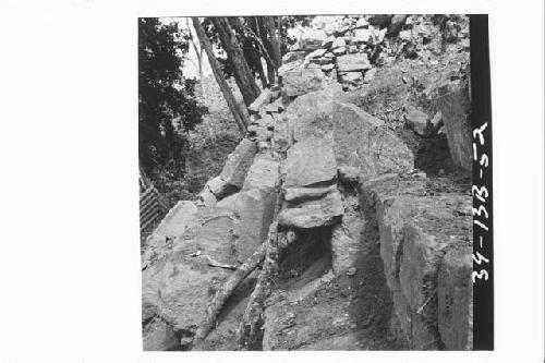 Projection of sculptured steps and upper stone mask exposed to show tenon