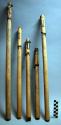 Shafts, bamboo, hollow, resinous material caked at ends, 2 with scoop ends