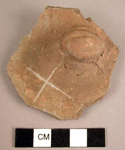 Potsherd showing lug grooved apparently for suspension
