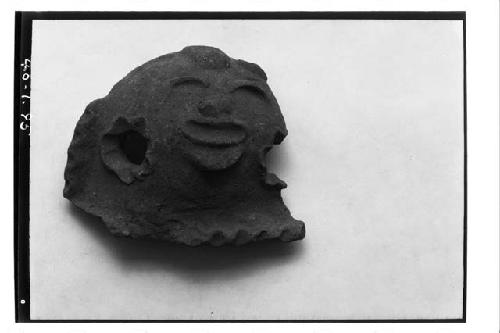 Head, apparently from incensario, unslipped brown ware.