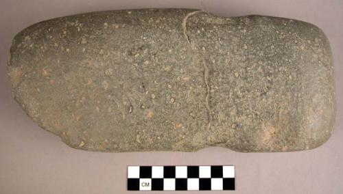 Notched groundstone axe