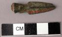Bronze arrowhead of triangular cross section with fragment of iron shaft