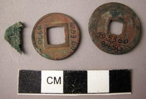 2 chinese copper coins and part of a third