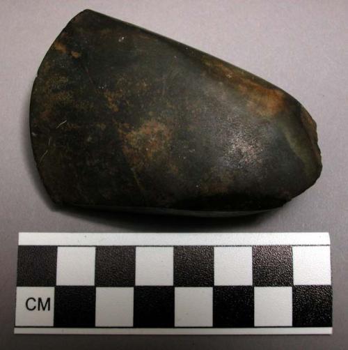 Stone axe heads and celts, ground and polished, e, f, and g appear to be basalt.