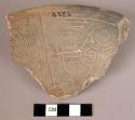 Earthenware rim sherd with incised designs