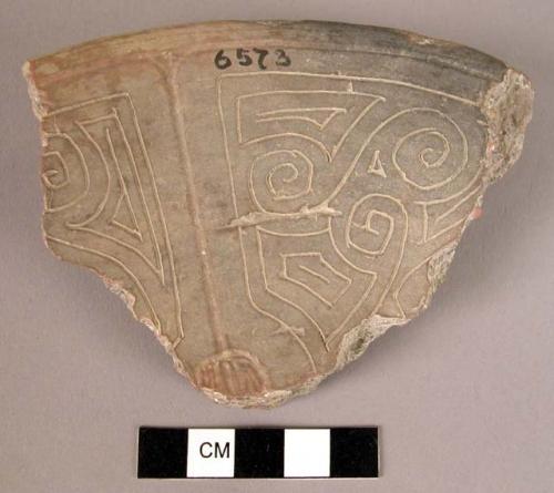 Earthenware rim sherd with incised designs