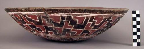 Ceramic, earthenware complete vessel, bowl, polychrome slipped interior and exterior, cord-impressed design; mended